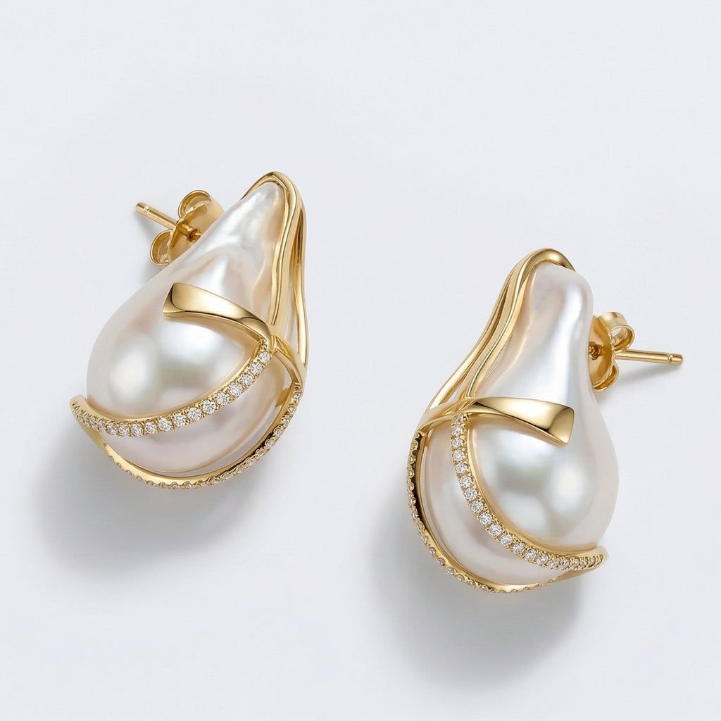 Pearl earrings with gold accents on a light gray background