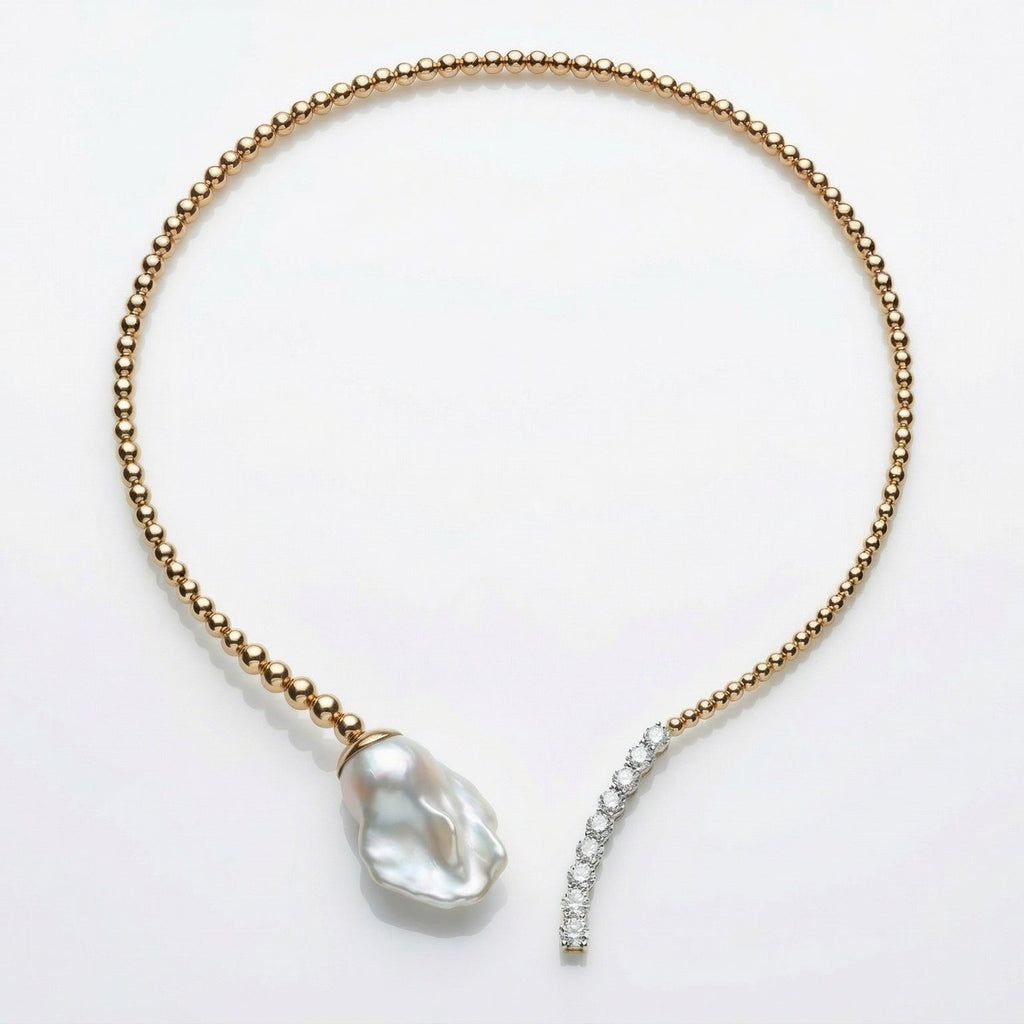 Gold necklace with a large pearl pendant on a white background